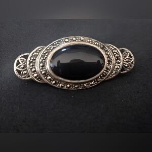 Elegant Black and Silver Brooch